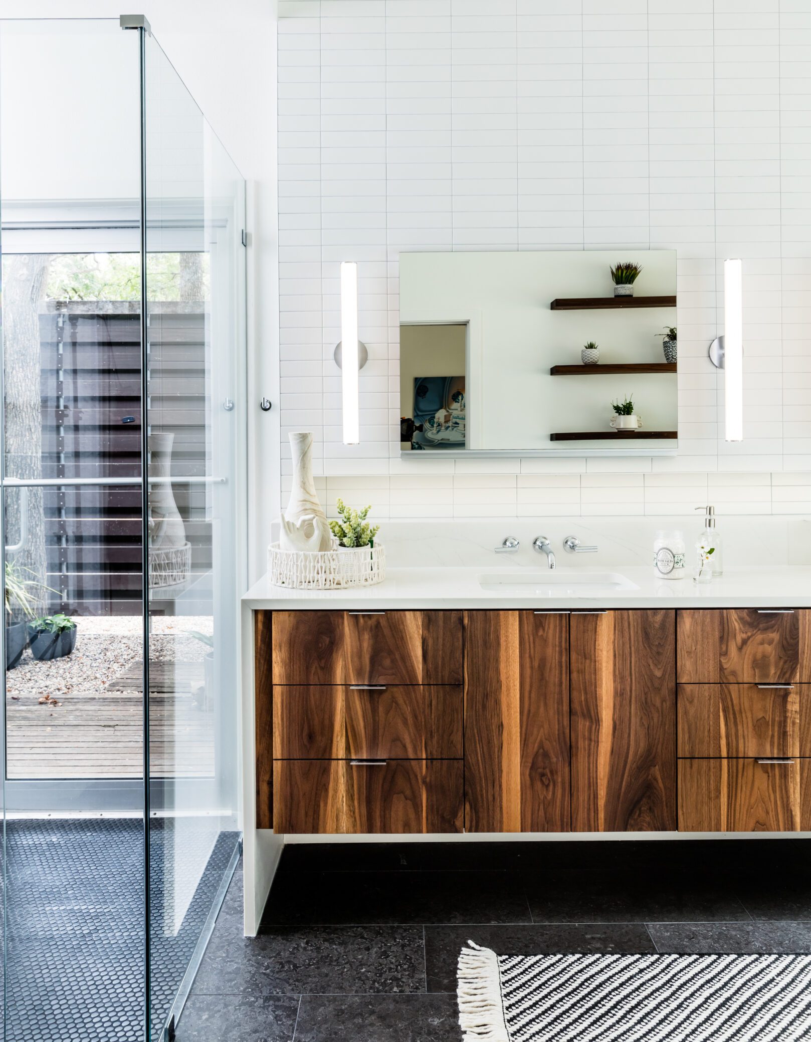 downtown austin organic midcentry modern floating cabinets luxury white bathroom remodel