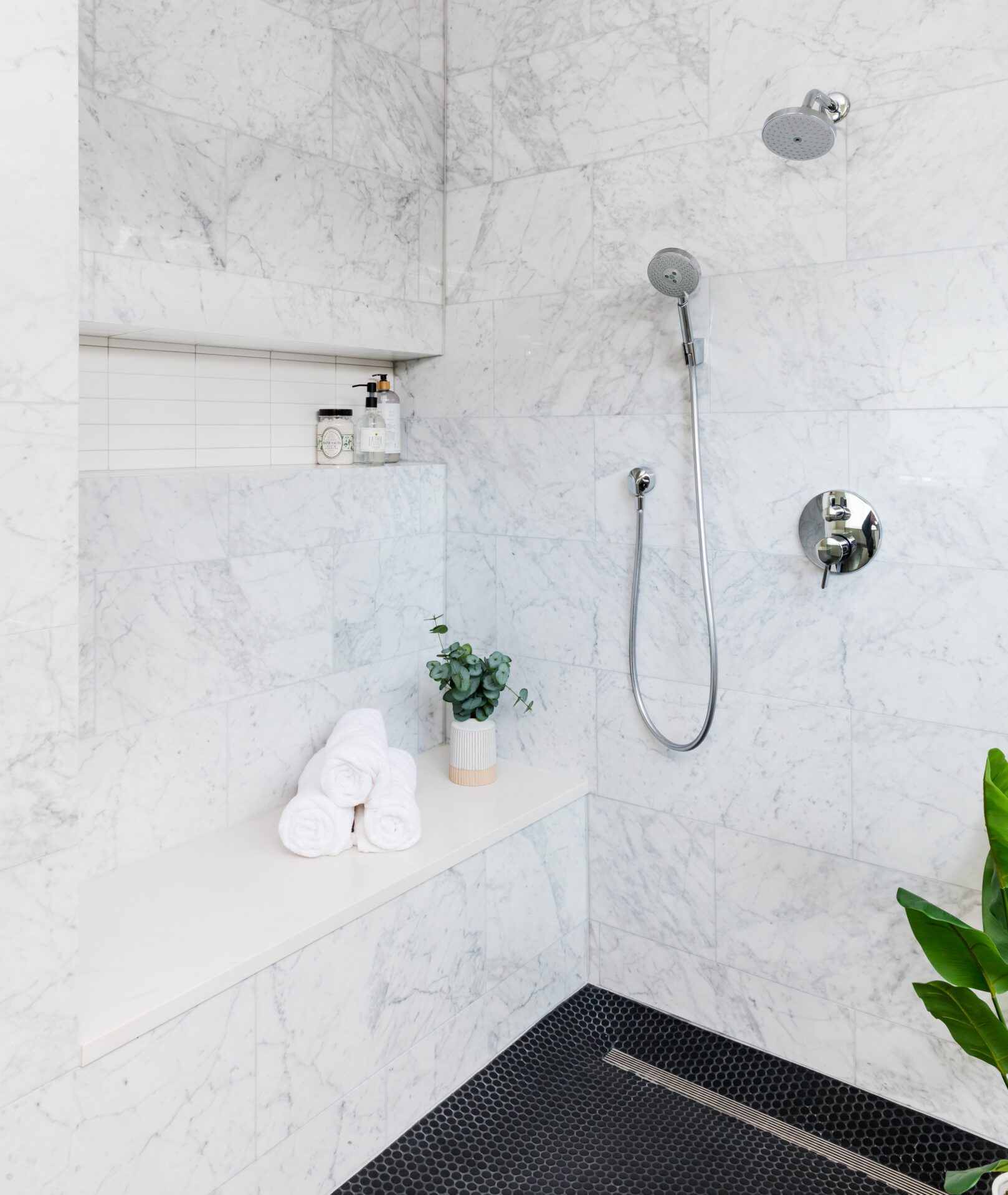 austin organic modern luxury bathroom remodel cararra marble tile shower