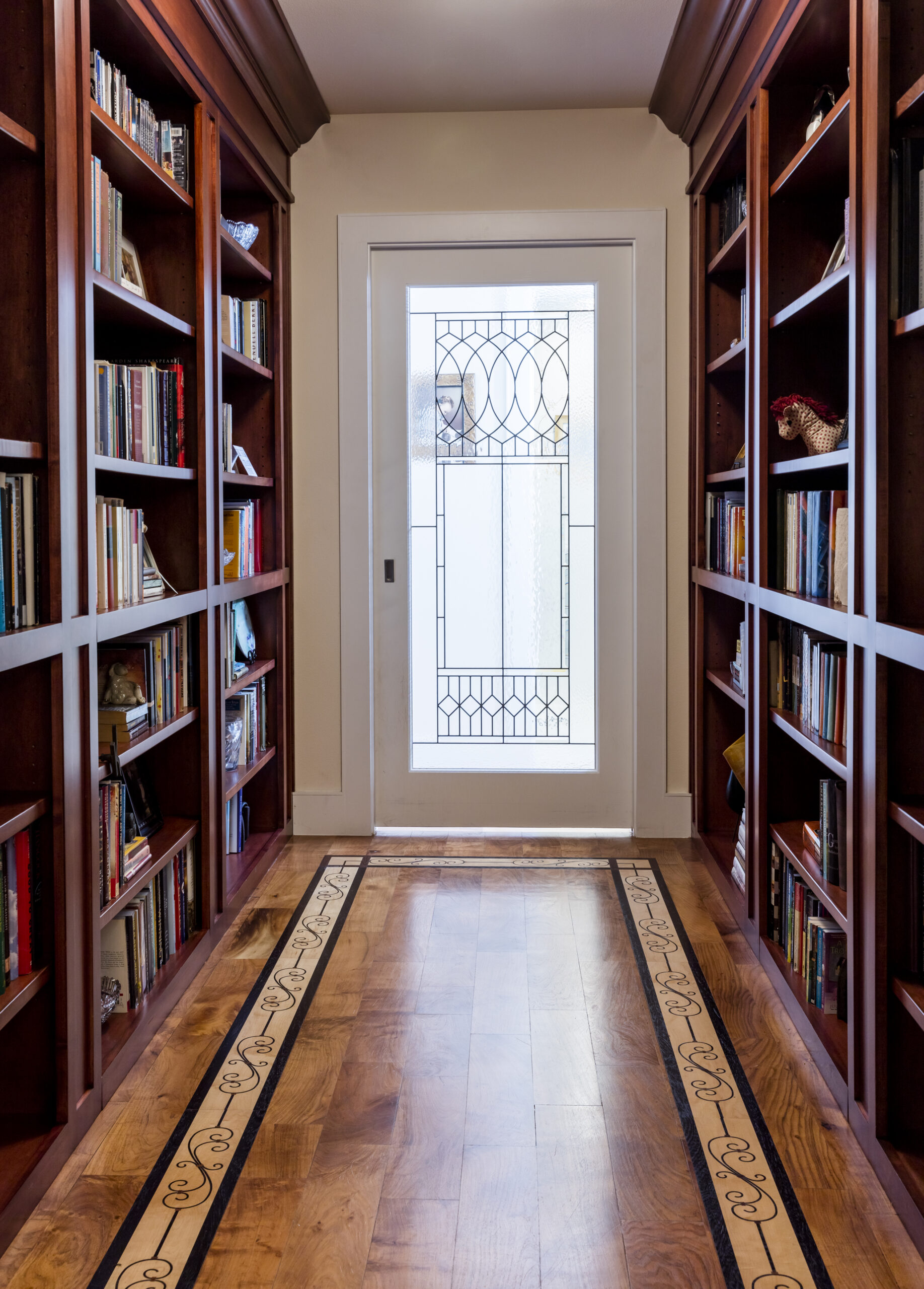 austin luxury interior design featuring custom wood library bookshelf